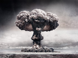 Atomic mushroom cloud which resembles the face of a laughing clown